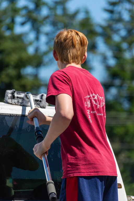 Boy washing RV