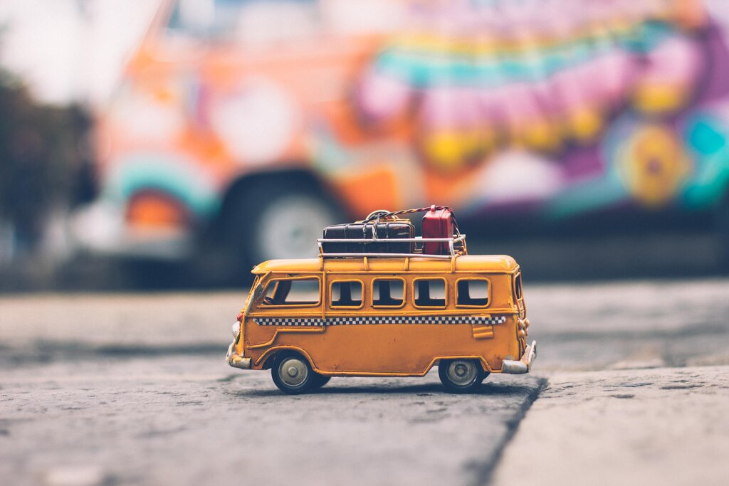 Toy camper with packed bags on top: your ultimate rv road trip packing list