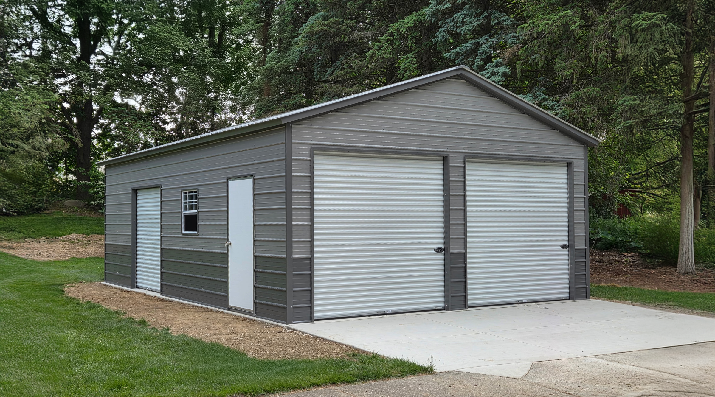 Two-car metal garage in Appleton, WI featuring pewter gray horizontal siding, two roll-up doors, and a walk-in door, built by American Steel Carports, Inc.