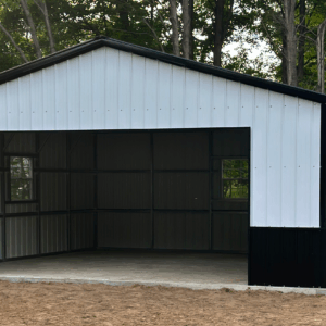Front view of a white and black two-car metal garage with an open bay and walk-in door, installed in Alto, Texas by American Steel Carports, Inc.
