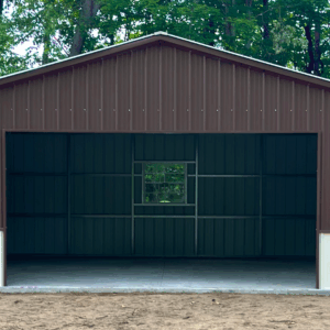 Front view of a two-tone metal garage in Ames, IA with earth brown upper panels, pebble beige lower panels, and a centered window, built by American Steel Carports, Inc.