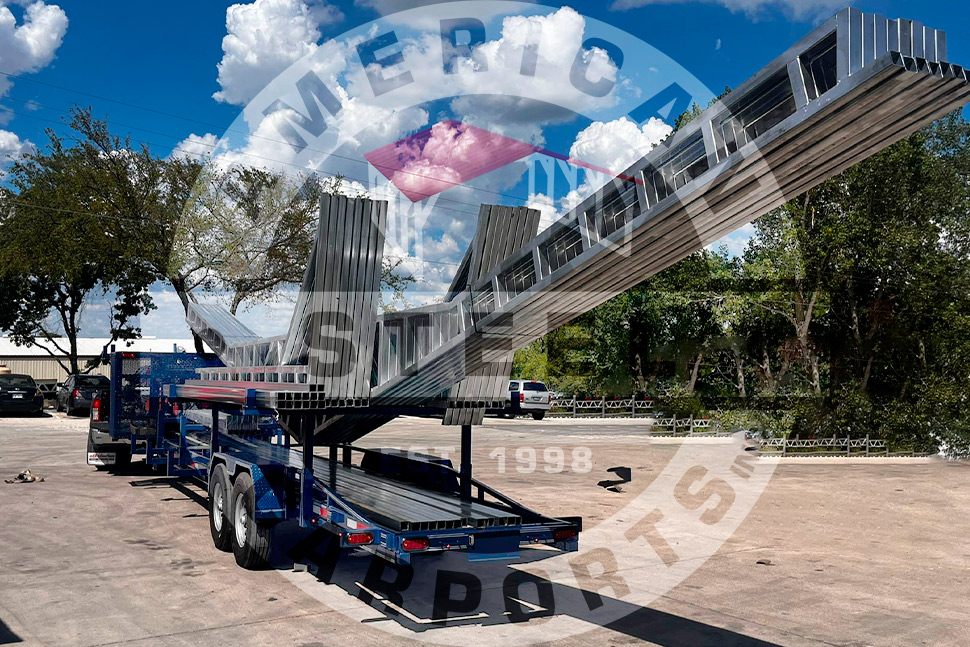 A gray metal structure with "American Steel Carports" signage, emphasizing winterization for Texas steel barns.