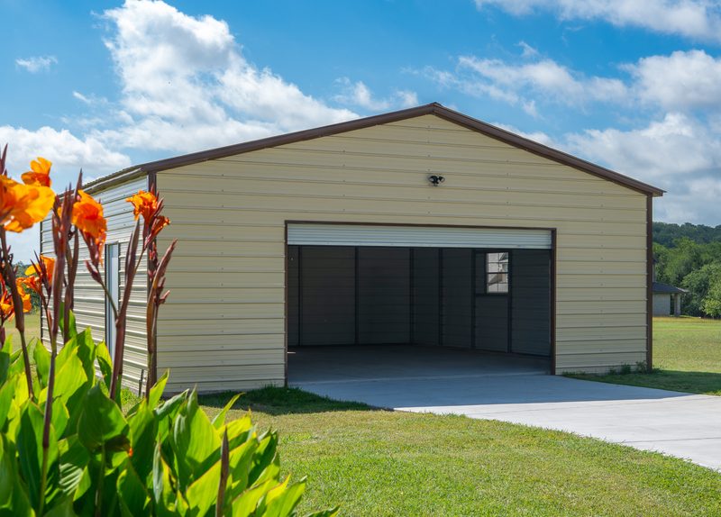Tan steel garage with roll-up door
