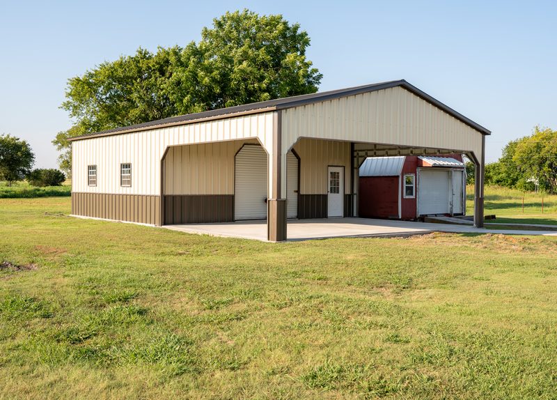 Tan utility building with covered bay