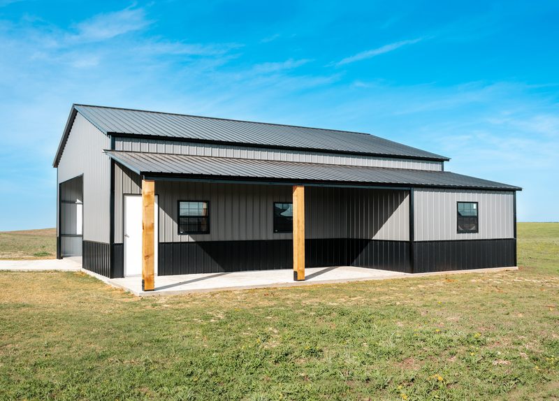 Grey steel workshop building with lean-to